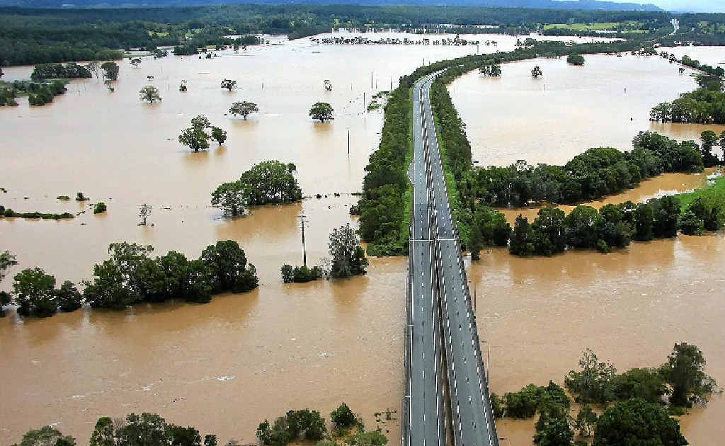 An aerial view of the Pacific Hwy at Urunga shows the extent of flooding.